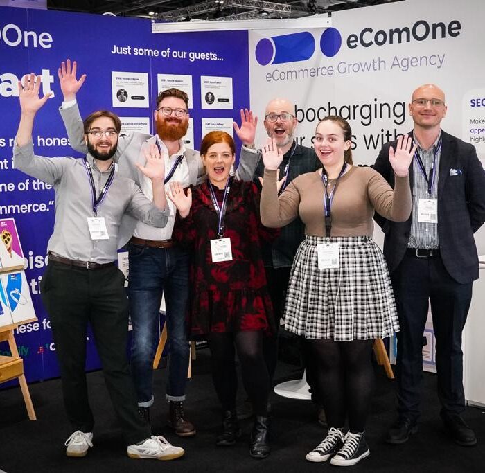 picture of the team at the ecommerce expo with smiley faces
