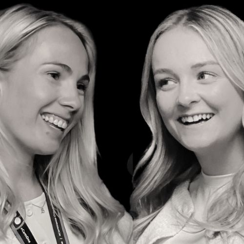 Black and white headshot ofEmma And Brittany laughing together
