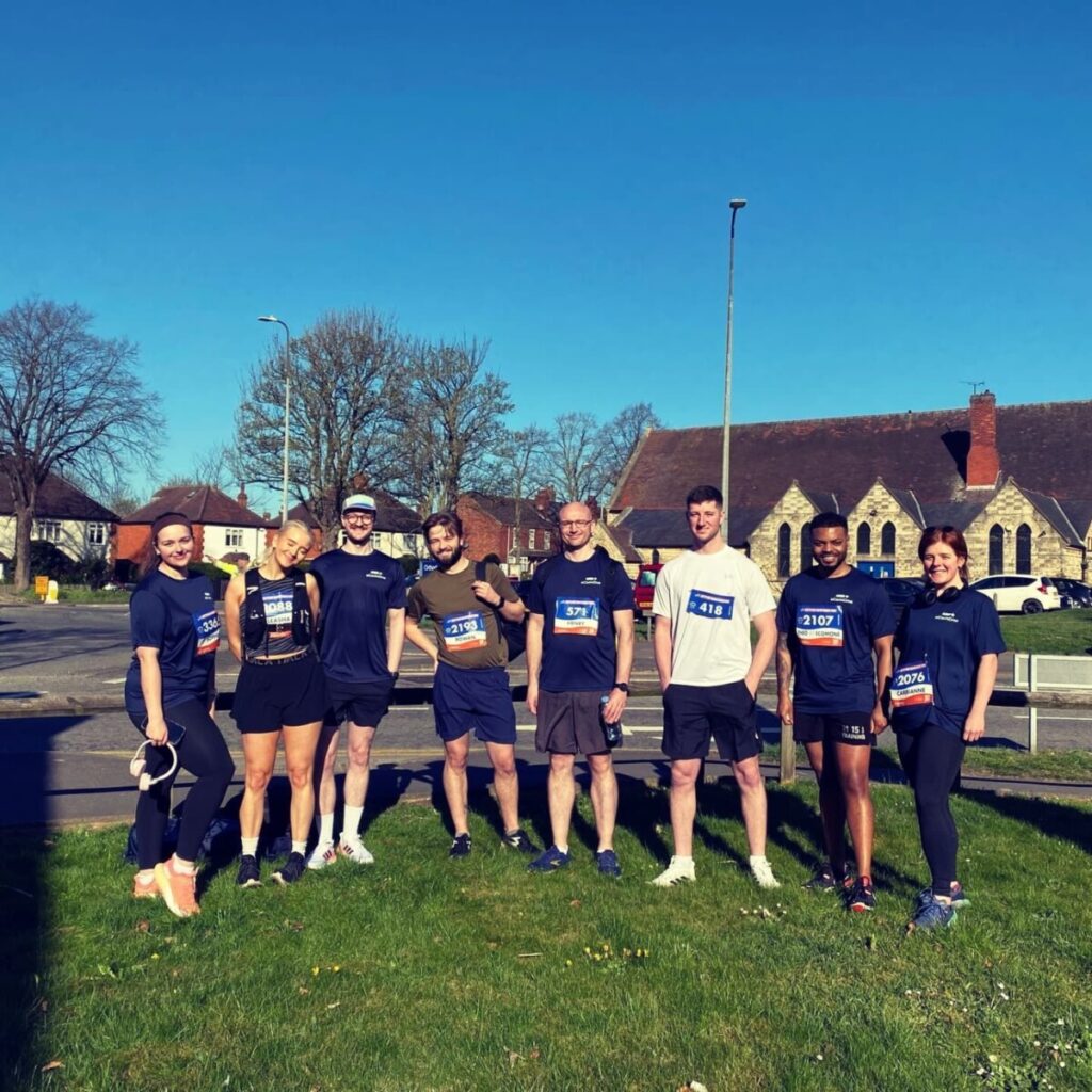 picture of the ecomone team ready to run the lincoln 10k, from left to right, sophie, eleasha, alex, rowan, henry, mike, theo and carrianne