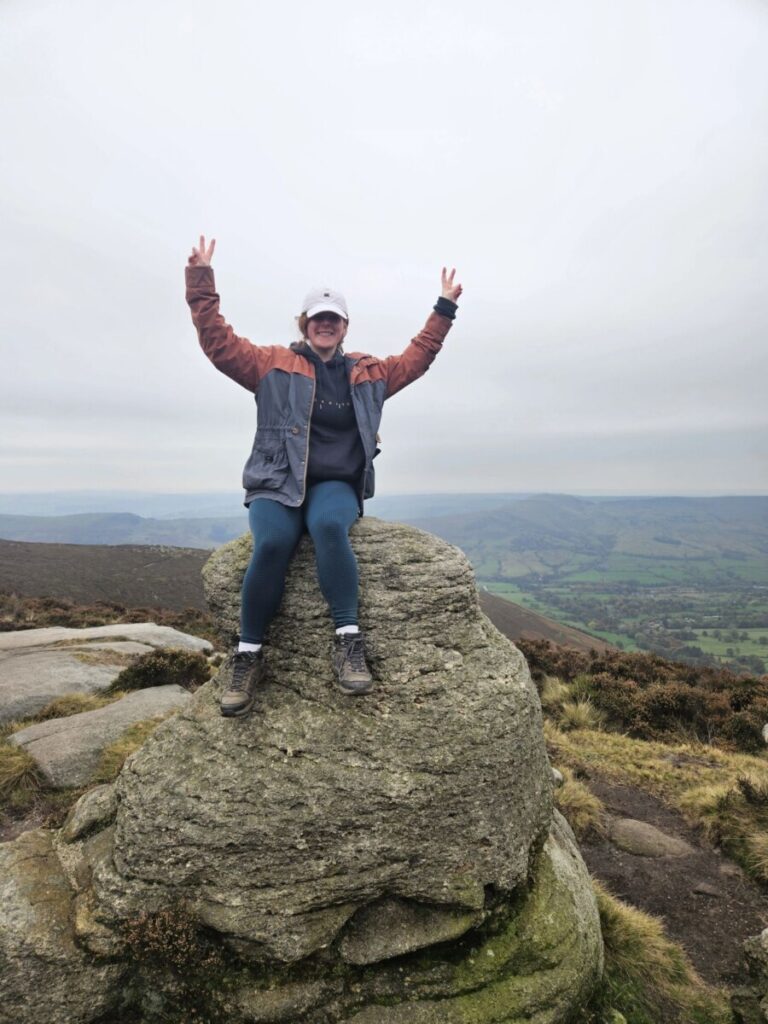 carrianne sat on a rock while hiking for 20 miles