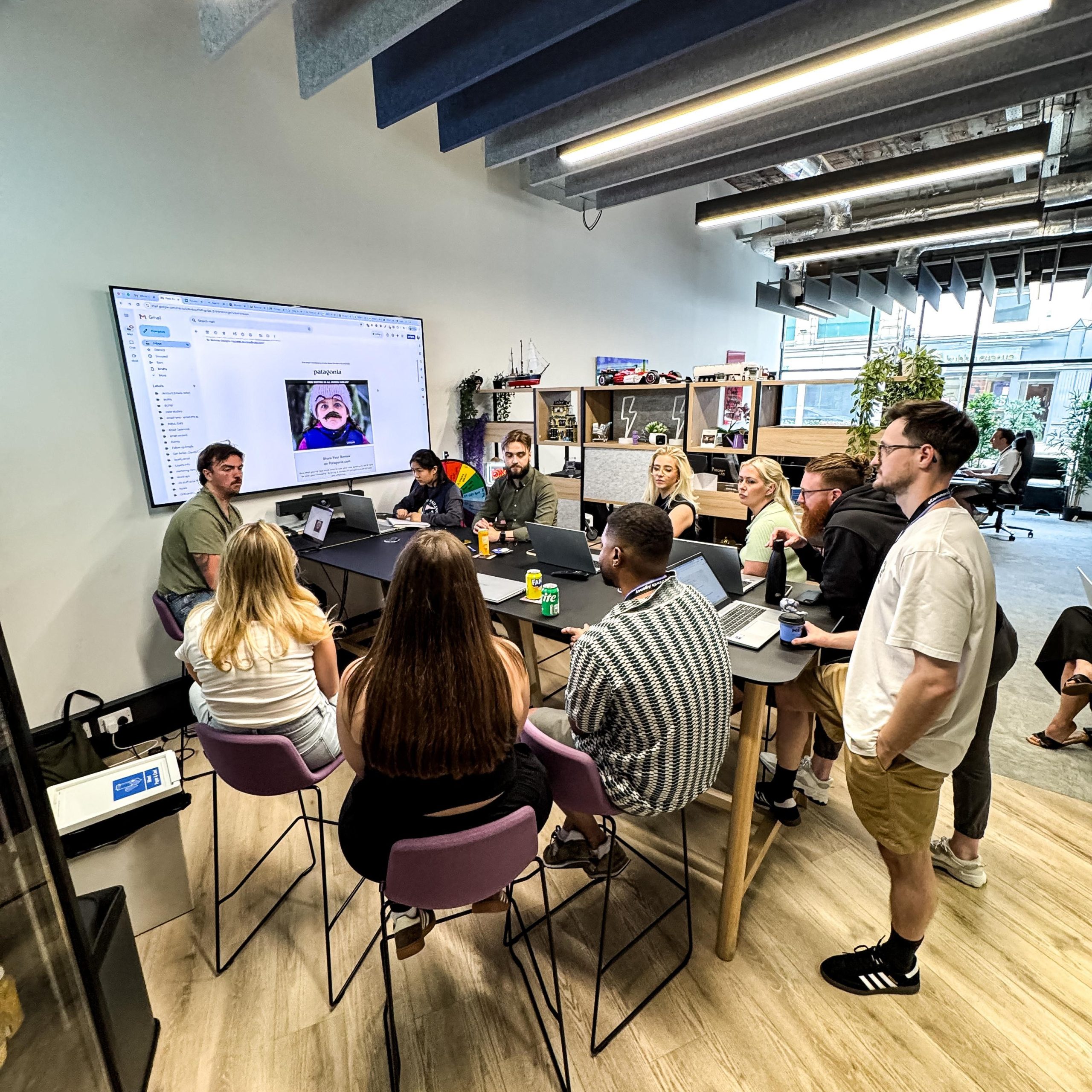 picture of jack mullane and the ecomone team talking about commercials