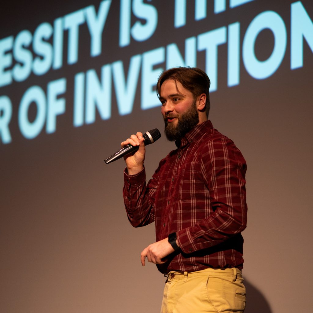 rowan on stage presenting about ai