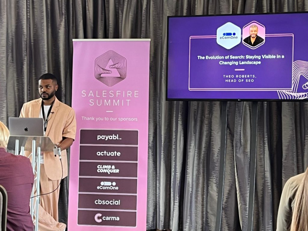 theo speaking at the salesfire summit about ai seo