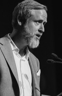 Man talking into a microphone
