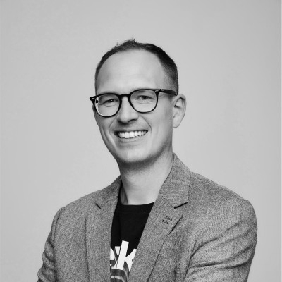 Man smiling wearing glasses